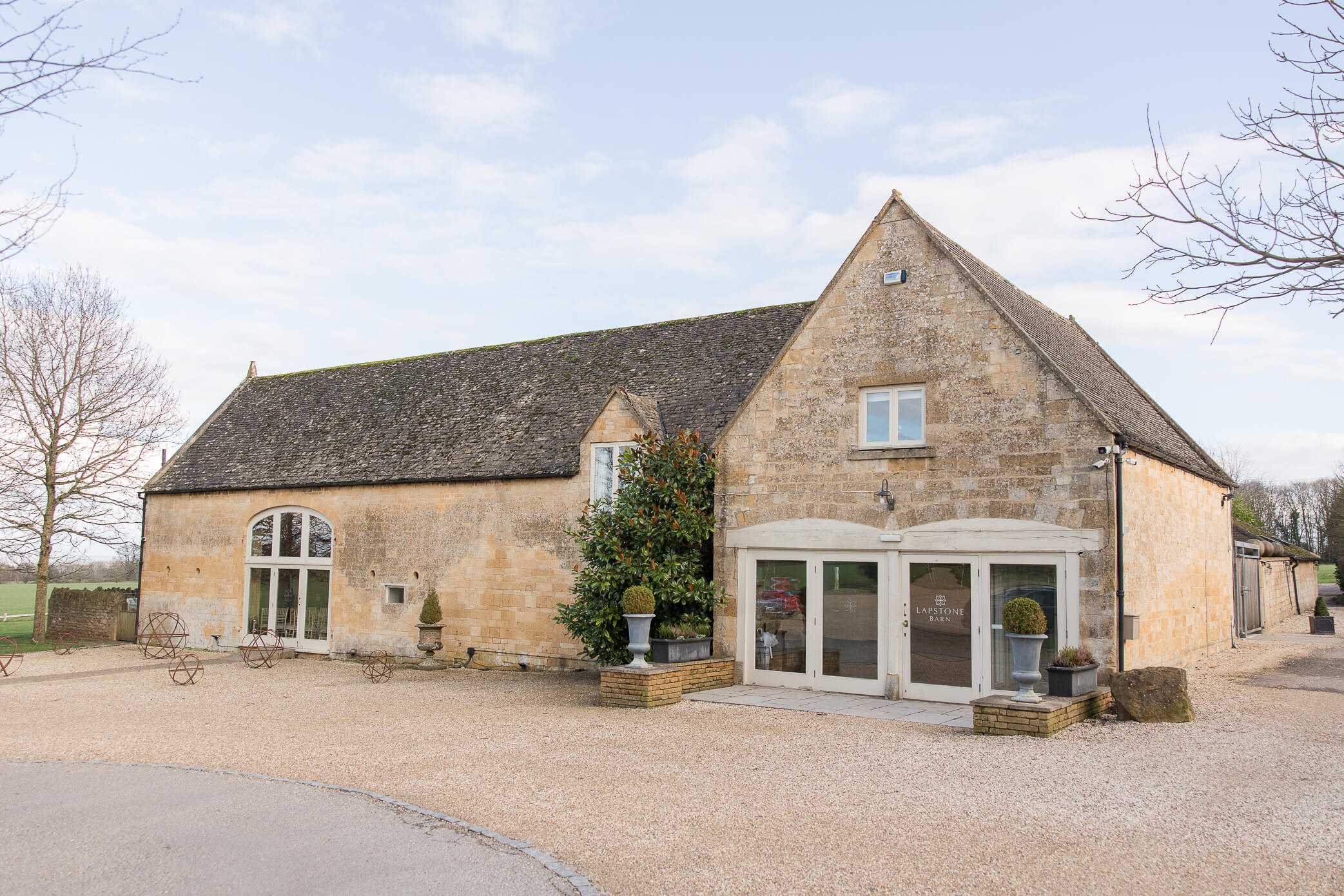 The outside stone building of Lapstone Barn wedding venue from the front entrance.