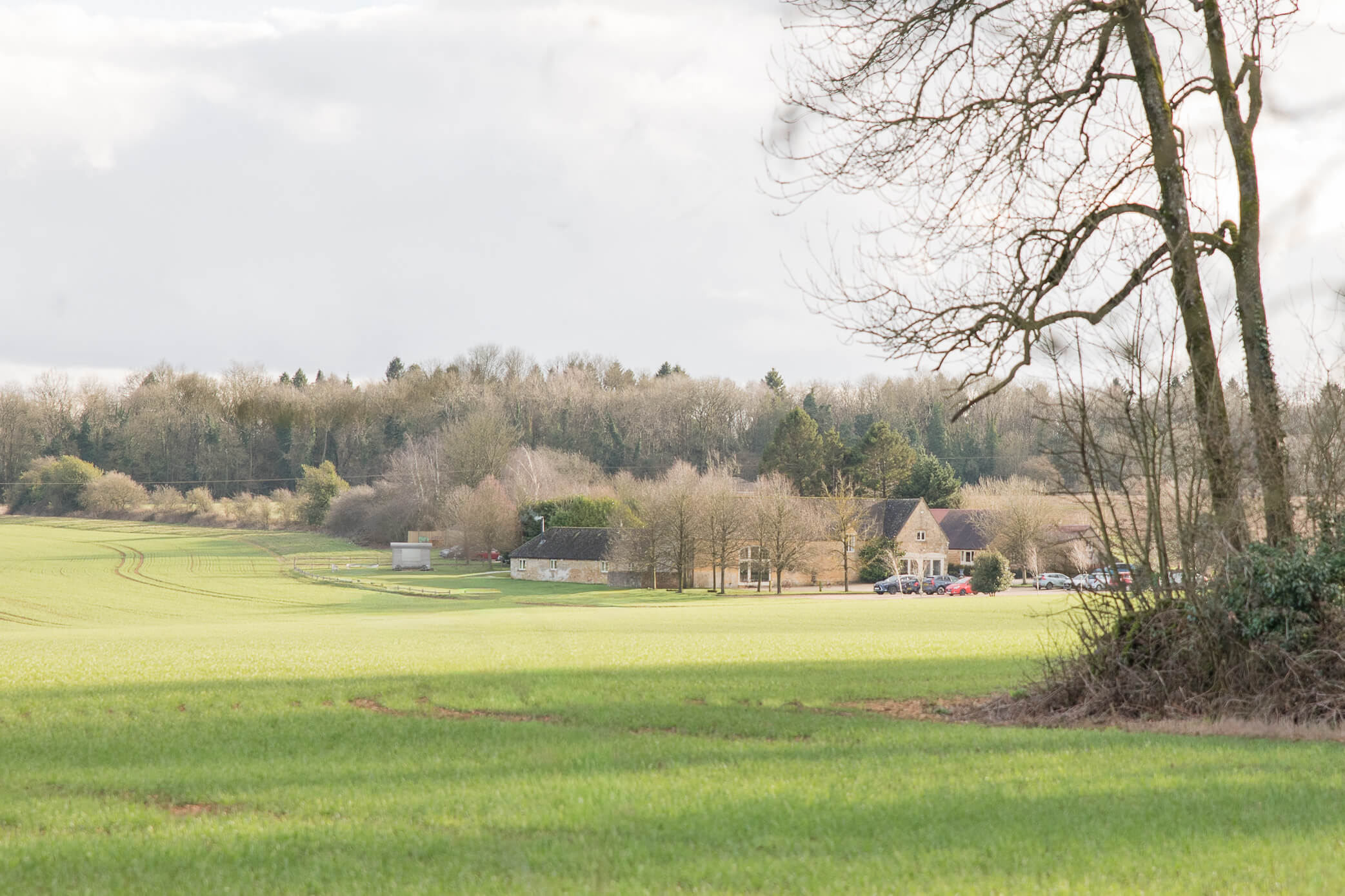 A distant view of Lapstone Barn wedding venue showing the beautiful surrounding fields and countryside.