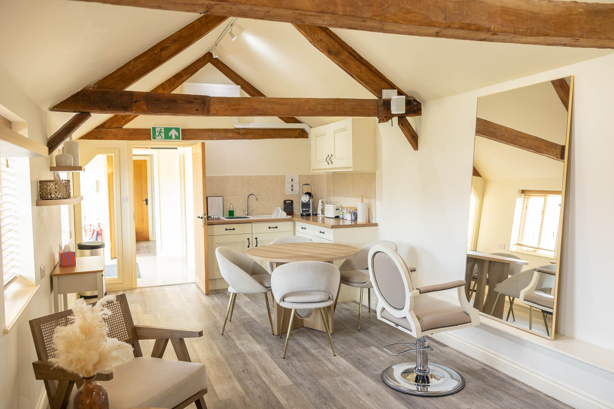 Bridal prep room at Caswell House. Fully equipped with large mirrors, a hair dressing chair, kitchenette, table and chairs, and tea and coffee.