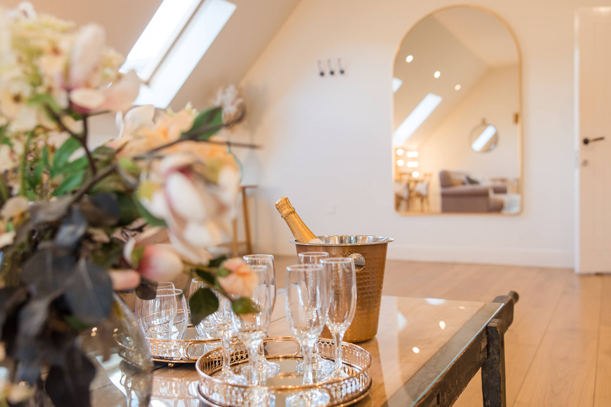 A bucket of bubbles and glasses in the bridal prep suite