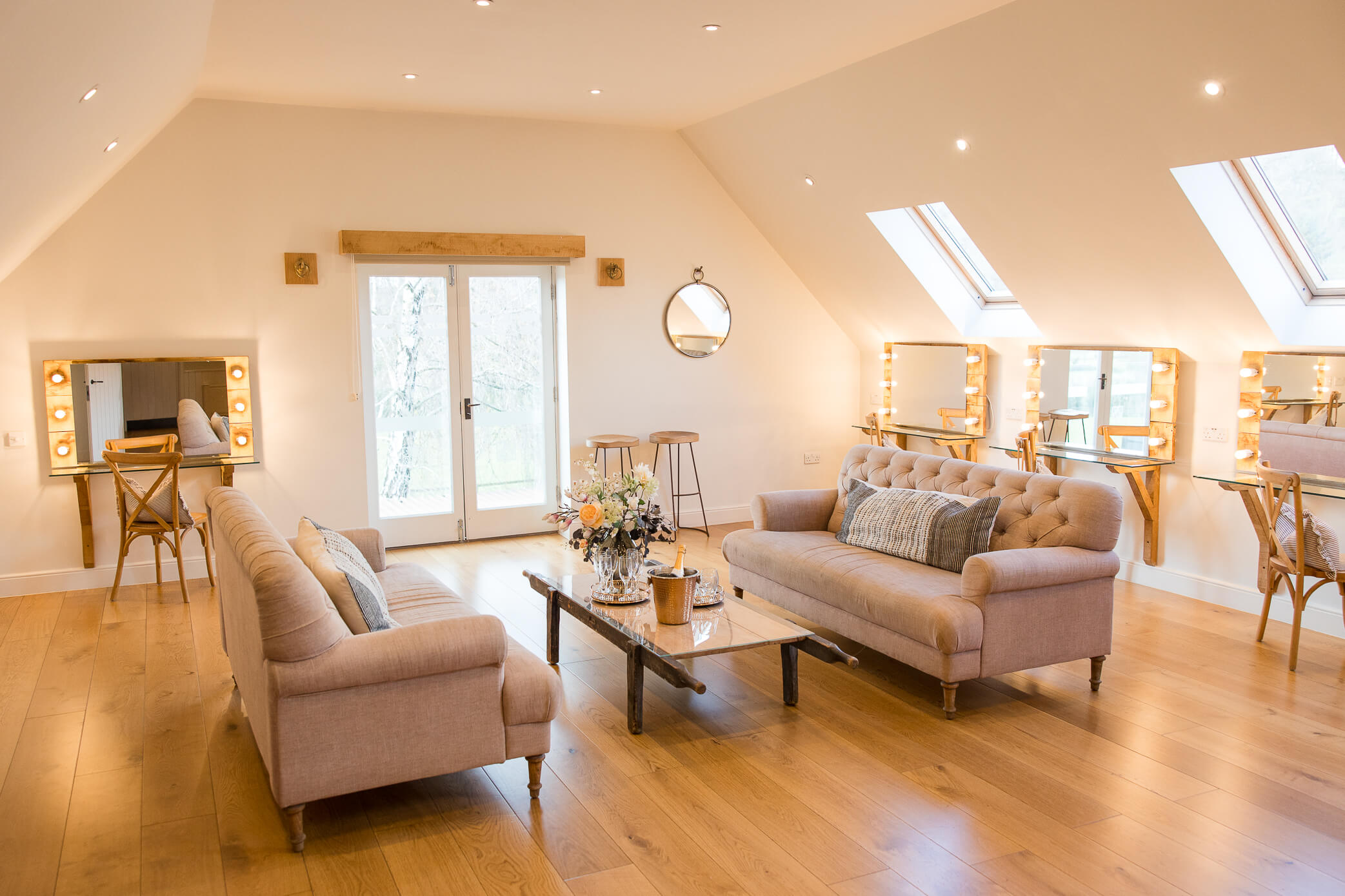 The bridal preparation suite with lots of natural light, makeup station, and comfortable couches