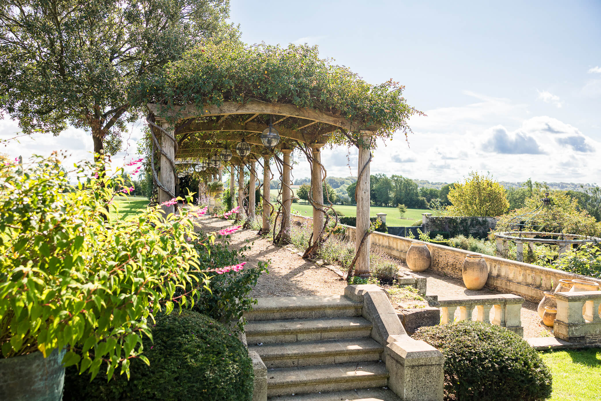 The Rose Pergula as one of the ceremony settings on the site, which overlooks the countryside