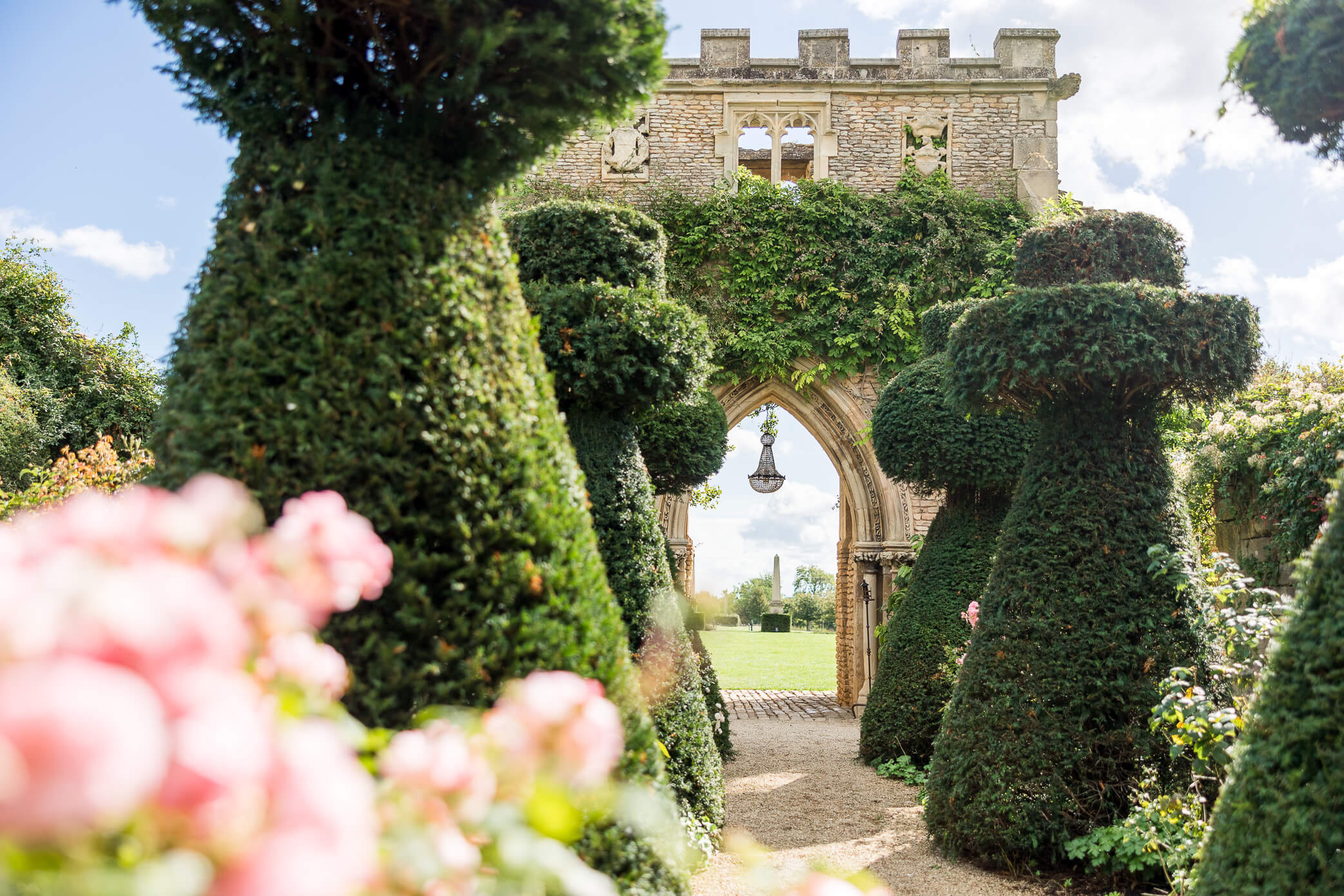 The Castle Arch at at Euridge Manor wedding with the crystal chandelier hanging from the ruins